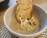 A picture of step 4 of Creamy Mushroom soup, drizzle truffle oil, rustic croutons.