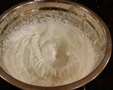 A picture of step 8 of Vanilla Layer Cake with Lemon Cream Filling and Lemon Whipped Cream Frosting.
