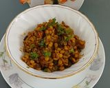 A picture of step 8 of Bitter gourd with chana dal masala.
