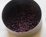 A picture of step 2 of Black rice porridge with fruits and nuts.
