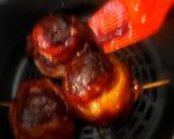 A picture of step 5 of BBQ Bacon-Wrapped Burger-Stuffed Onion Bombs.