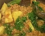 A picture of step 7 of Qeema aloo.