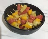 A picture of step 1 of Fruit kebabs.
