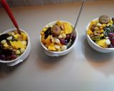 A picture of step 4 of #endyearchallenge mixed fruit salaad different nuts.