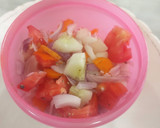 A picture of step 2 of Simple tomato cucumber salad.