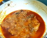 A picture of step 12 of Chicken Rogan Josh.