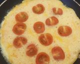A picture of step 4 of Two cheese and cherry tomato omelette :).