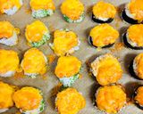 A picture of step 12 of Baked rolls under a cheese cap.