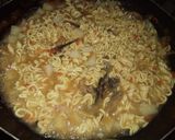 A picture of step 4 of Indomie with potato and dried fish.