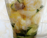 A picture of step 2 of Cucumber ginger and orange juice.