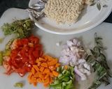 A picture of step 1 of Spicy maggie with lots of veggies.