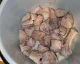 A picture of step 1 of Yellow Rice with Pork Ribs in the Ninja Foodi.