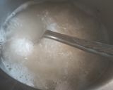 A picture of step 1 of Fried rice doi potato raita and salad.