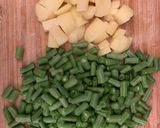 A picture of step 1 of Aloo and French bean Dry sabzi.