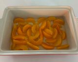 A picture of step 2 of Peach Dump Cake.