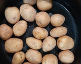 A picture of step 1 of Nepali style Aloo Dum with Chiwda /Poha/ Flattened rice.