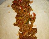 A picture of step 12 of Saucy beef wraps.