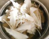 Hình bước làm 3 của món Canh Măng Chua Nấu Cá Cơm