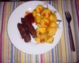 A picture of step 7 of Roasted potatoes and coated smokies.