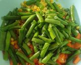 A picture of step 4 of Nigerian fried rice.