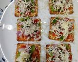 A picture of step 2 of Cream cracker pizza bites.