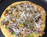A picture of step 5 of Moongdaal pizza with peas.