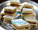 A picture of step 4 of Kaju Burfi Sandwich with leftover kaju burfi.