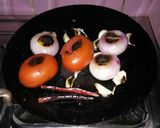 A picture of step 2 of Roasted onion and tomato salad.