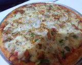 A picture of step 1 of Chicken achari pizza.