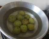 A picture of step 1 of Stir fried amla and green chillies.