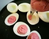 A picture of step 12 of Deviled Eggs with Beetroot Hummus.