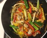 A picture of step 4 of Seafood mix on fried veggies.