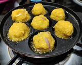 A picture of step 4 of Corn fritters in appe pan.
