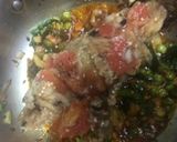 A picture of step 4 of Baingan bharta with green peas.