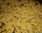 A picture of step 3 of Baked rosemary potatoe wedges.