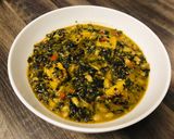 A picture of step 12 of White Bean and Swiss Chard Egusi Soup with seed coated Polenta bites.