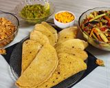 Foto del paso 14 de la receta: 🌮🌶️ Tacos🌶️ 🌮 De pollo picantito con vegetales salteados, guacamole y cheddar
