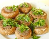 A picture of step 2 of Hummus stuffed chessey mushrooms.