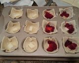 A picture of step 2 of Brie cranberry pastry bites.