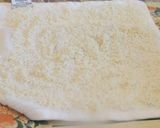 A picture of step 2 of Sweet Puttu (steamed rice cake from Kerala) with coconut.