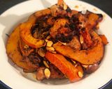 A picture of step 8 of Tray bake pumpkin & chicken thighs topped with roast pumpkin seeds.
