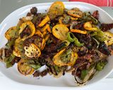 Une image de l'étape 11 de Courgettes jaunes et poivrons verts aux tomates séchées et épices.