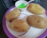 A picture of step 2 of Maggi stuffed jacket potatoes.
