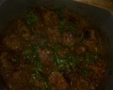 A picture of step 10 of Cheesy meatballs in sauce.