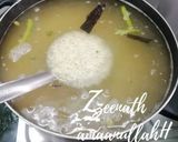 A picture of step 1 of Hyderabadi Kachchi Aqhni Chicken Dum Biryani.