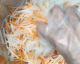A picture of step 8 of Kouhaku Namasu (Daikon and carrot pickles).