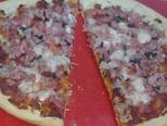 Foto del paso 6 de la receta Pizza casera con un toque de albahaca