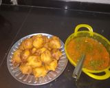 A picture of step 5 of Aloo (potato) bada with curry.