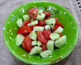 A picture of step 1 of Tomato, Cucumber, Fig, and Melekouni Salad.