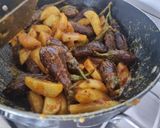 A picture of step 3 of Stuffed Brinjal potatoes in gravy.